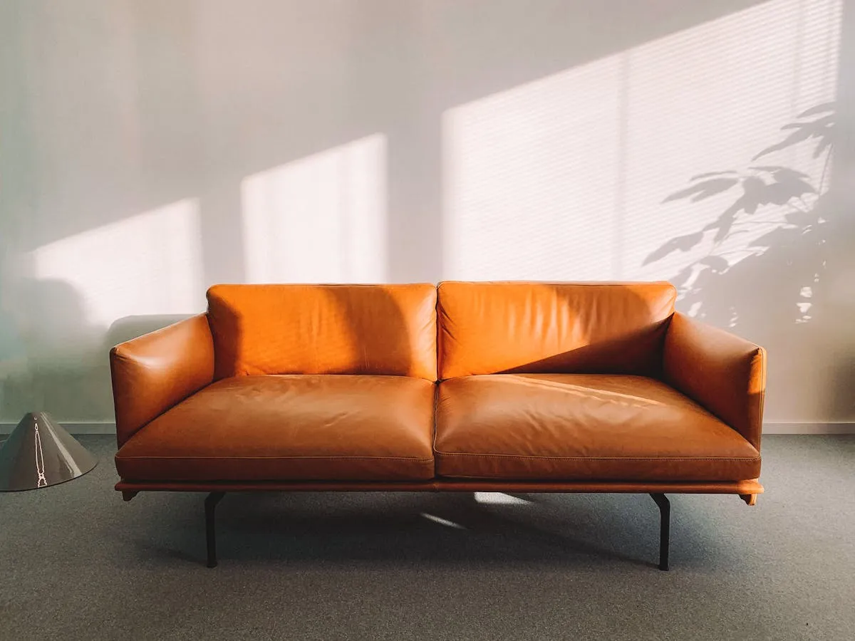 Professional sofa reupholstery in Singapore — restored 3-seater with premium fabric